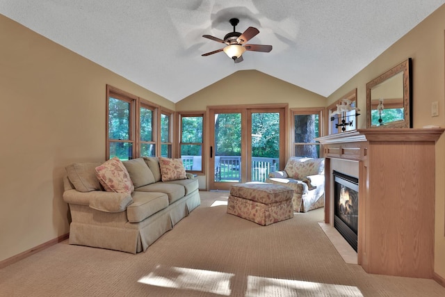 6 Pleasant View Ln, Circle Pines, MN 55014 - living room with light carpet, a ceiling fan, vaulted ceiling, a fireplace with flush hearth, and a textured ceiling