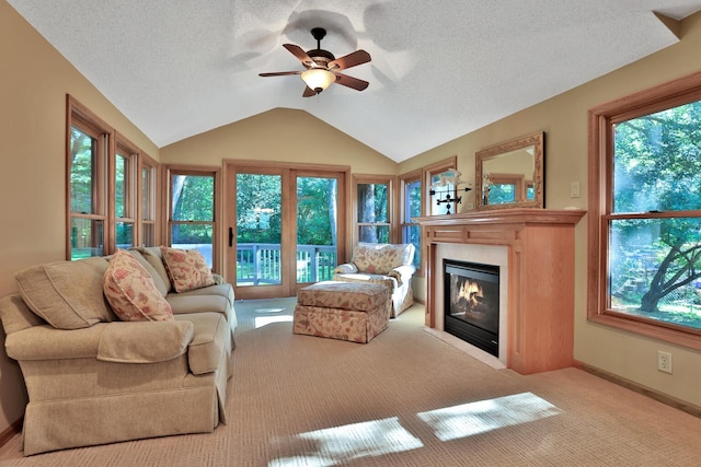 6 Pleasant View Ln, Circle Pines, MN 55014 - carpeted living area featuring a ceiling fan, vaulted ceiling, a fireplace with flush hearth, and a textured ceiling