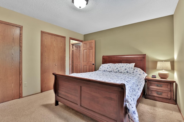 6 Pleasant View Ln, Circle Pines, MN 55014 - carpeted bedroom featuring a textured ceiling and two closets