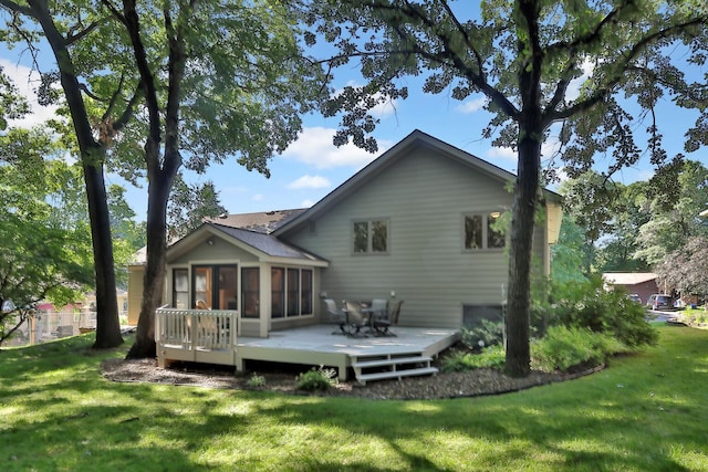 6 Pleasant View Ln, Circle Pines, MN 55014 - back of property with a sunroom, a wooden deck, and a yard