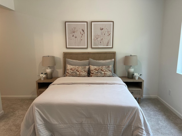 carpeted bedroom featuring baseboards