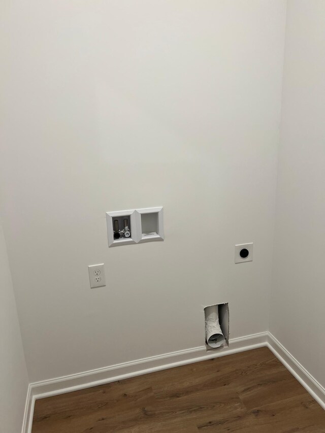 washroom featuring electric dryer hookup, hookup for a washing machine, and dark wood-style flooring