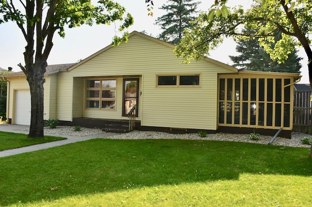 308 Maple Ave S, Thief River Falls, MN 56701 - view of front of home with a garage, a front lawn, and entry steps