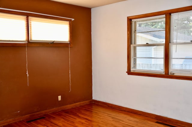 308 Maple Ave S, Thief River Falls, MN 56701 - empty room featuring wood finished floors and baseboards