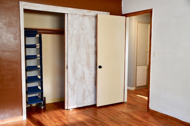 308 Maple Ave S, Thief River Falls, MN 56701 - unfurnished bedroom featuring wood finished floors and a closet