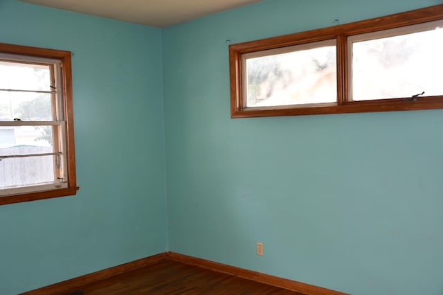 308 Maple Ave S, Thief River Falls, MN 56701 - empty room with baseboards and dark wood-type flooring