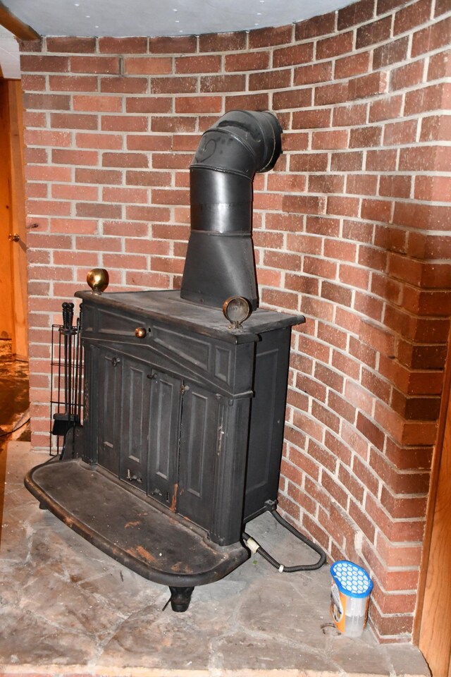 308 Maple Ave S, Thief River Falls, MN 56701 - detailed view of a wood stove and brick wall
