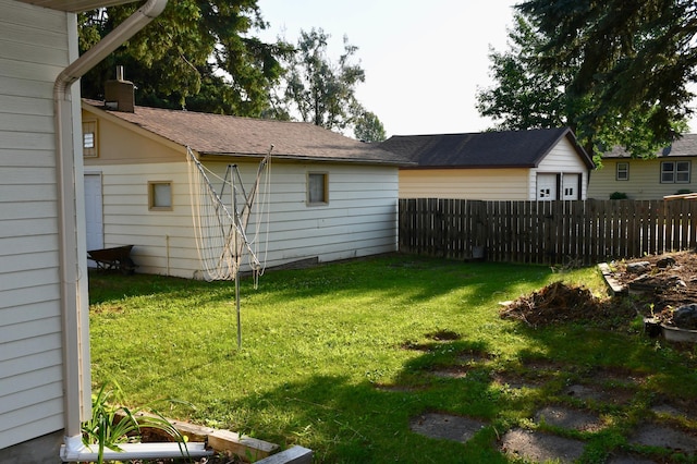 308 Maple Ave S, Thief River Falls, MN 56701 - view of yard featuring a garage