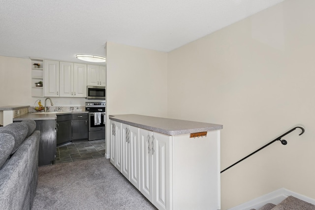 13525 Zenith Ln, Eden Prairie, MN 55346 - kitchen featuring appliances with stainless steel finishes, open shelves, white cabinetry, carpet floors, and a center island