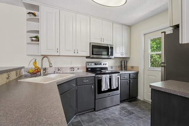 13525 Zenith Ln, Eden Prairie, MN 55346 - kitchen featuring appliances with stainless steel finishes, open shelves, white cabinets, and a textured ceiling