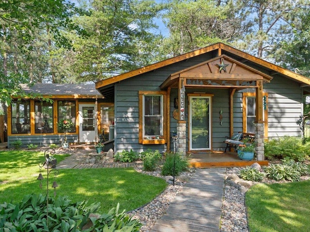 26803 Pelican Beach Rd, Merrifield, MN 56465 - view of front of house with a front lawn and a sunroom