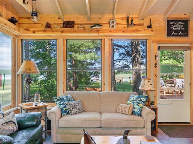 26803 Pelican Beach Rd, Merrifield, MN 56465 - living area with beam ceiling, plenty of natural light, wooden walls, and wood finished floors