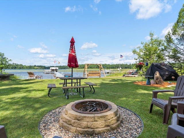 26803 Pelican Beach Rd, Merrifield, MN 56465 - view of grassy yard featuring an outdoor fire pit and a water view