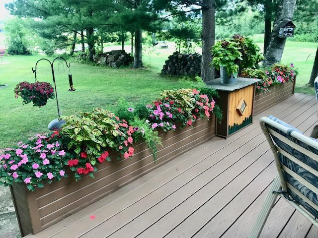 26803 Pelican Beach Rd, Merrifield, MN 56465 - wooden terrace featuring a yard