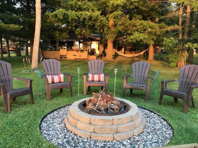 26803 Pelican Beach Rd, Merrifield, MN 56465 - view of green lawn featuring a fire pit