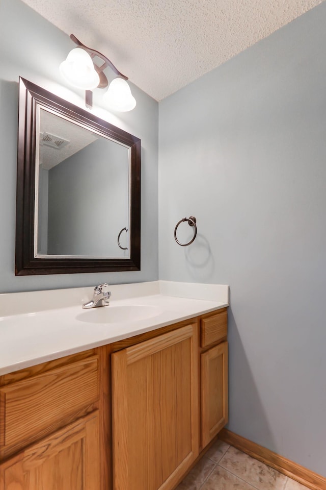 16424 Elm Creek Ln Unit 4029, Lakeville, MN 55044 - bathroom with vanity, tile patterned flooring, and a textured ceiling