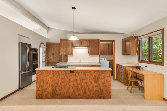8040 Lea Rd, Bloomington, MN 55438 - kitchen featuring appliances with stainless steel finishes, light countertops, washer / dryer, and brown cabinets