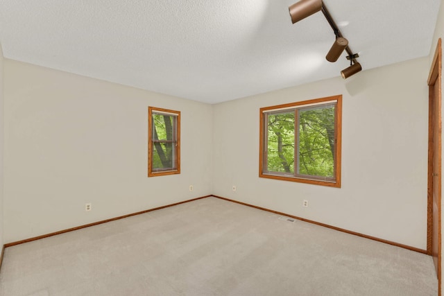 8040 Lea Rd, Bloomington, MN 55438 - empty room with plenty of natural light and light colored carpet
