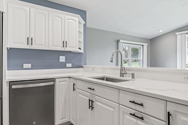2100 10th St SW, Austin, MN 55912 - kitchen with stainless steel dishwasher, plenty of natural light, and white cabinetry