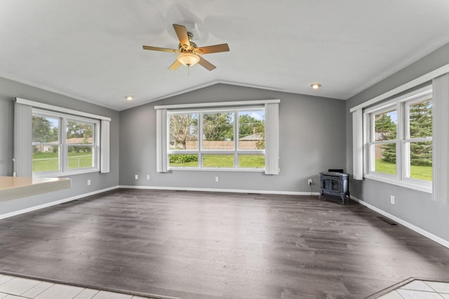 2100 10th St SW, Austin, MN 55912 - unfurnished living room featuring lofted ceiling, healthy amount of natural light, and wood finished floors