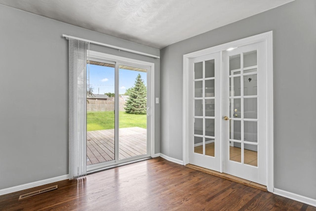 2100 10th St SW, Austin, MN 55912 - doorway featuring french doors and wood finished floors