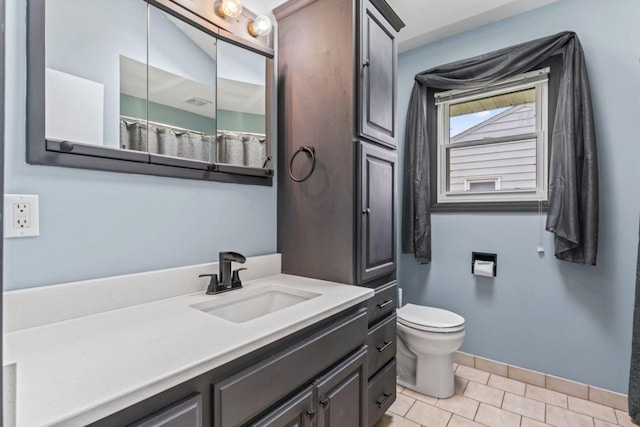 2100 10th St SW, Austin, MN 55912 - bathroom with vanity and tile patterned flooring