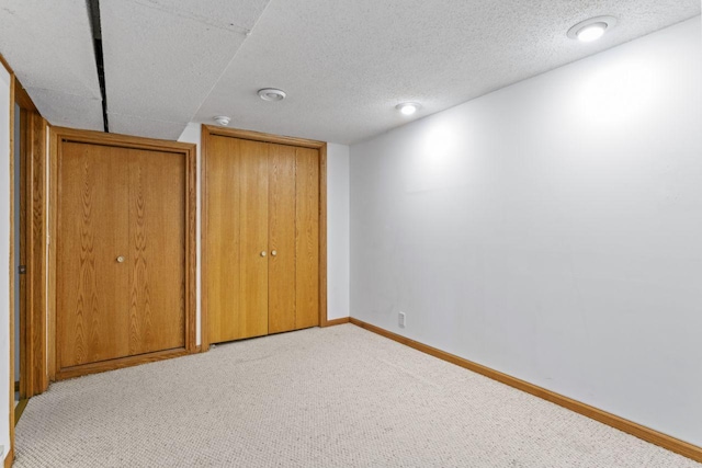 2100 10th St SW, Austin, MN 55912 - unfurnished bedroom featuring carpet flooring and baseboards