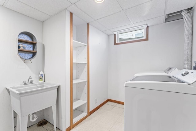 2100 10th St SW, Austin, MN 55912 - laundry room with washer and dryer and baseboards