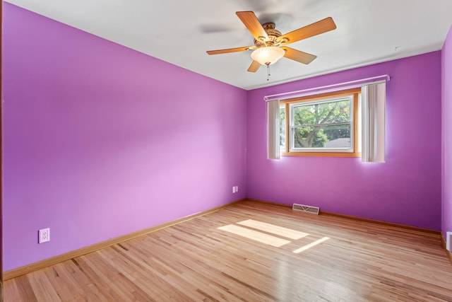 2100 10th St SW, Austin, MN 55912 - spare room featuring light wood finished floors and a ceiling fan
