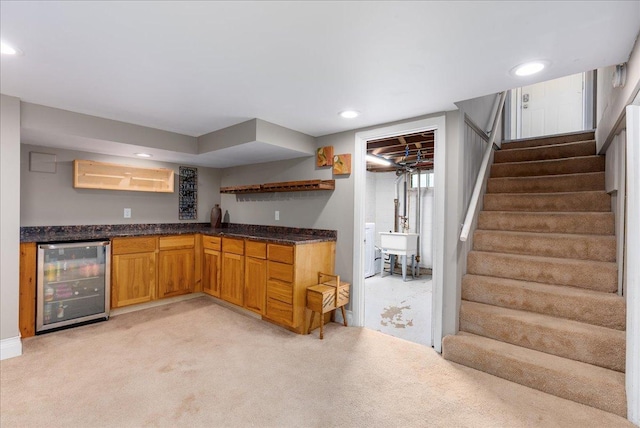 1331 Scheffer Ave, Saint Paul, MN 55116 - kitchen with beverage cooler, light colored carpet, open shelves, recessed lighting, and dark stone counters