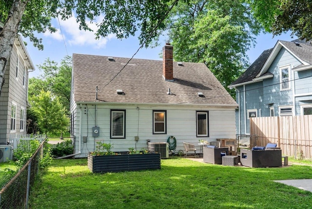 1331 Scheffer Ave, Saint Paul, MN 55116 - rear view of property with a chimney, roof with shingles, and an outdoor living space