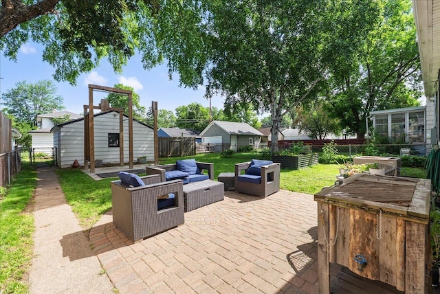 1331 Scheffer Ave, Saint Paul, MN 55116 - fenced backyard with a patio, an outdoor hangout area, and an outbuilding