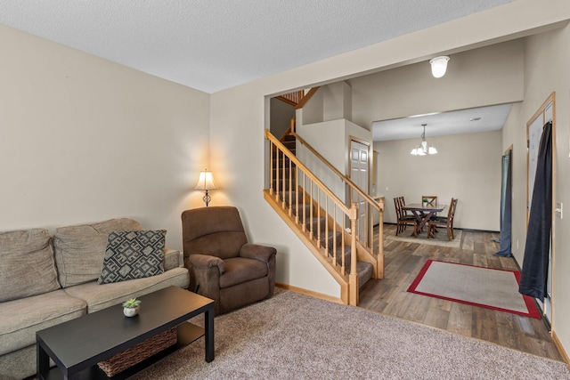 7735 Lachman Ave NE, Otsego, MN 55301 - living room featuring stairs, wood finished floors, and a chandelier