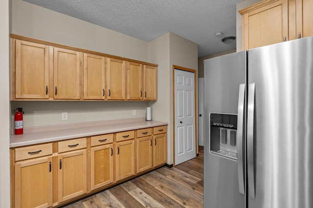 7735 Lachman Ave NE, Otsego, MN 55301 - kitchen with stainless steel refrigerator with ice dispenser, dark wood-style flooring, light brown cabinets, light countertops, and a textured ceiling