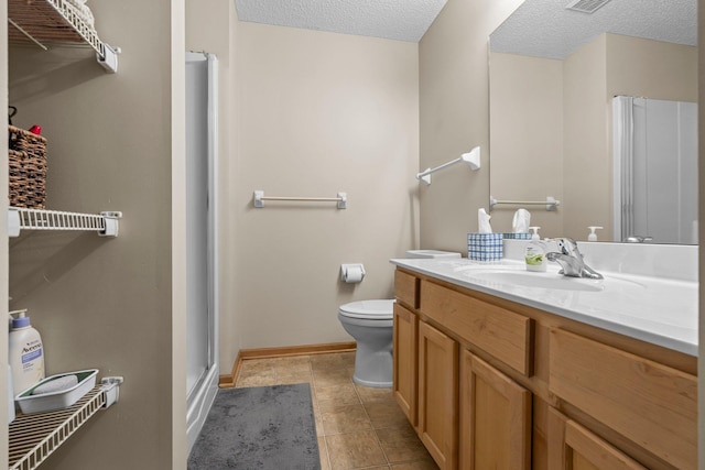 7735 Lachman Ave NE, Otsego, MN 55301 - bathroom featuring vanity, a shower stall, a textured ceiling, and tile patterned floors