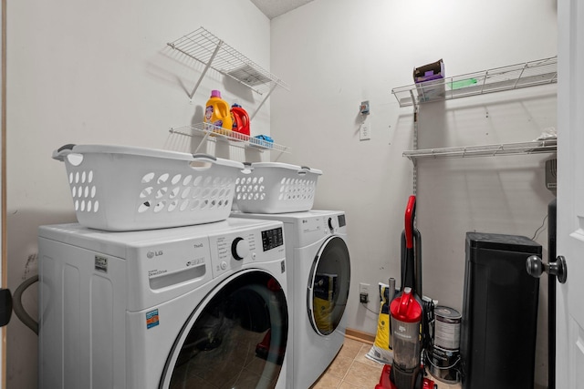 7735 Lachman Ave NE, Otsego, MN 55301 - laundry room featuring washing machine and clothes dryer and light tile patterned floors