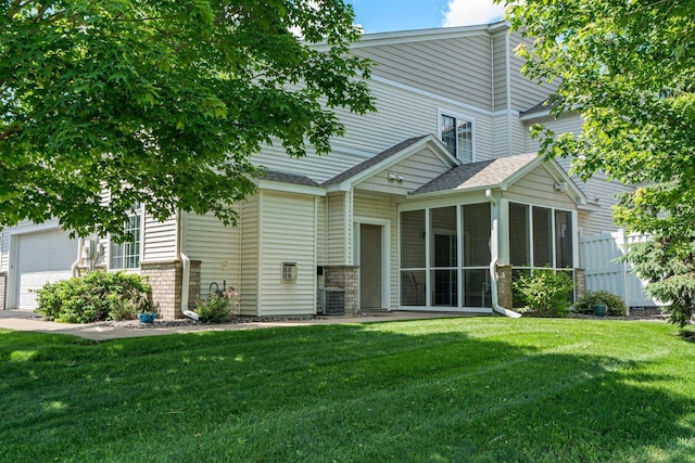7735 Lachman Ave NE, Otsego, MN 55301 - back of house featuring a sunroom, roof with shingles, and a garage