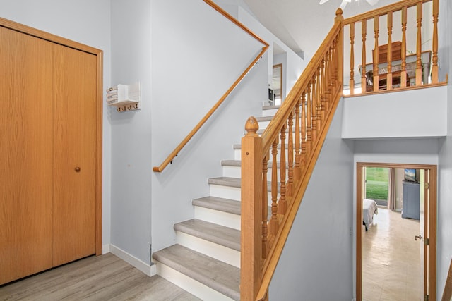940 14th Ln SE, Cambridge, MN 55008 - stairs with baseboards and wood finished floors