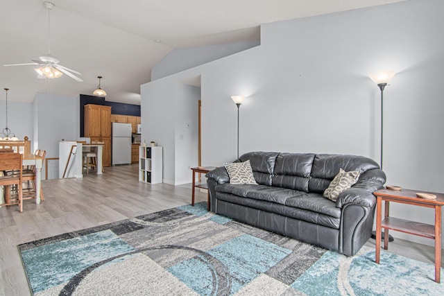 940 14th Ln SE, Cambridge, MN 55008 - living area featuring a ceiling fan, lofted ceiling, and light wood-style floors