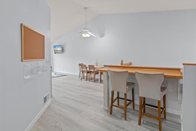 940 14th Ln SE, Cambridge, MN 55008 - dining space featuring ceiling fan, lofted ceiling, and light wood-type flooring