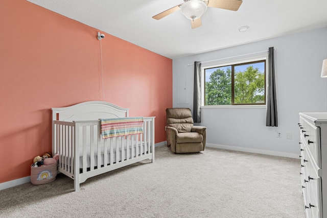 940 14th Ln SE, Cambridge, MN 55008 - bedroom with carpet flooring, ceiling fan, and a crib