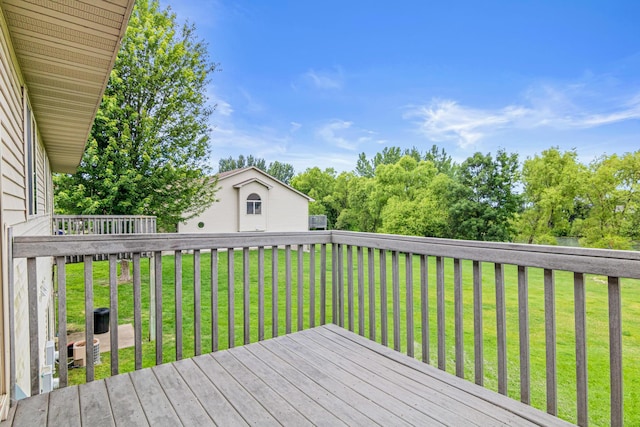 940 14th Ln SE, Cambridge, MN 55008 - wooden deck featuring a lawn and an outdoor structure