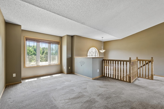 30354 118th St, Baldwin Twp, MN 55371 - carpeted spare room featuring a textured ceiling and baseboards