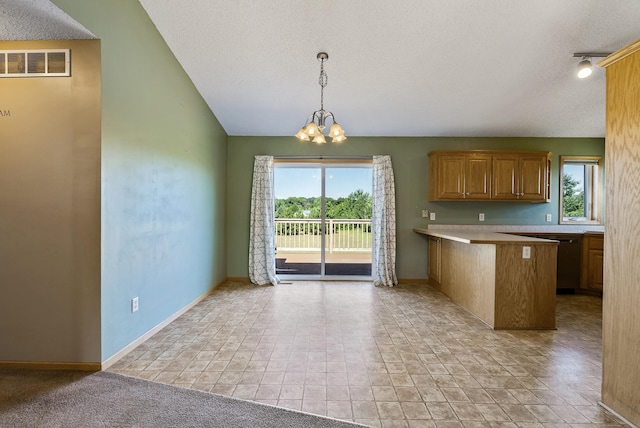 30354 118th St, Baldwin Twp, MN 55371 - kitchen featuring a chandelier, a peninsula, stainless steel dishwasher, a textured ceiling, and light countertops