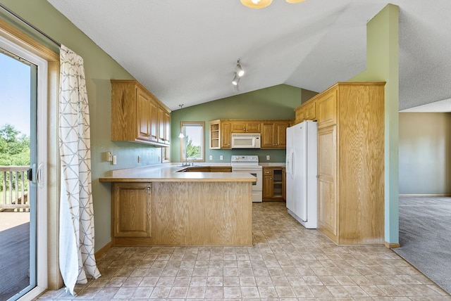 30354 118th St, Baldwin Twp, MN 55371 - kitchen with white appliances, lofted ceiling, light countertops, a peninsula, and light stone finish floors