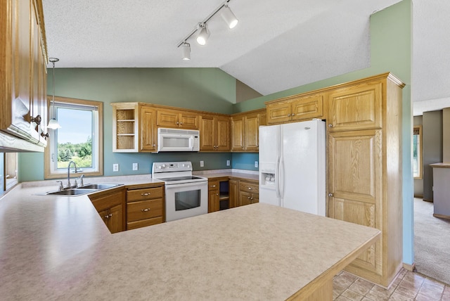 30354 118th St, Baldwin Twp, MN 55371 - kitchen featuring white appliances, track lighting, vaulted ceiling, a peninsula, and light countertops