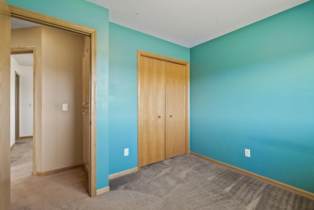 30354 118th St, Baldwin Twp, MN 55371 - unfurnished bedroom featuring carpet, a closet, and a textured ceiling