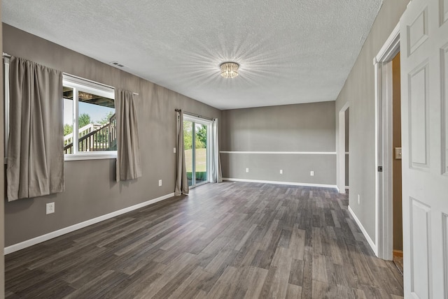30354 118th St, Baldwin Twp, MN 55371 - unfurnished room featuring dark wood-style floors and a textured ceiling
