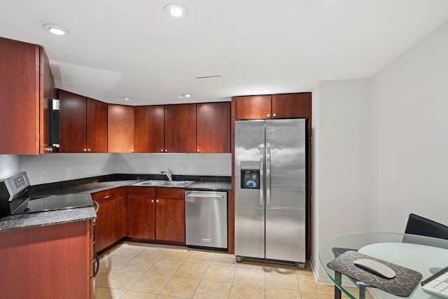 20 2nd St NE Unit P1008, Minneapolis, MN 55413 - kitchen featuring stainless steel appliances, dark countertops, light tile patterned floors, and recessed lighting