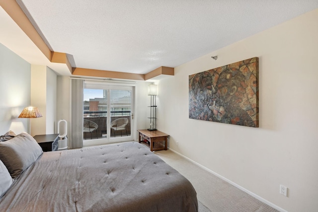 20 2nd St NE Unit P1008, Minneapolis, MN 55413 - carpeted bedroom with baseboards and a textured ceiling